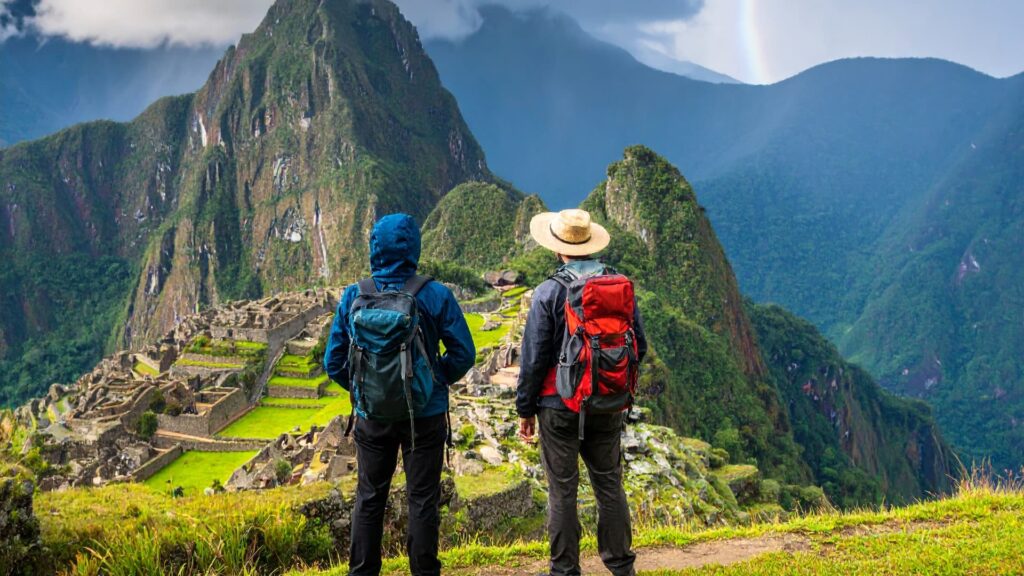 Two adventurers enjoying the view of one of the Seven Wonders.- Qosqo Expeditions